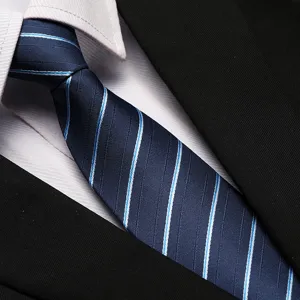 Detailed close-up of a stylish blue striped business necktie paired with a crisp white shirt and black suit.