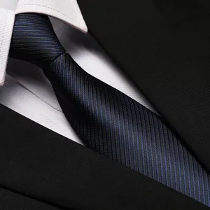 Close-up detail of blue and black striped business necktie with suit collar, elegant texture.