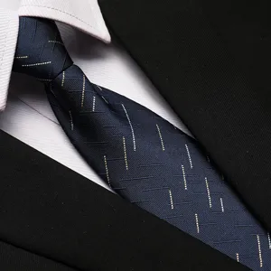 Close-up view of a navy blue business necktie featuring subtle stripe details paired with shirt.