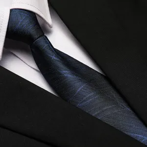 Close-up detail of a classic blue striped business necktie paired with formal wear.