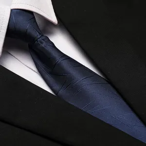 Detailed view of a stylish navy blue business tie with abstract lines, perfect for formal wear.