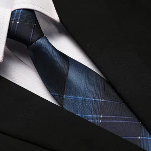 Detailed view of blue and black plaid formal business tie for office work and professional events.