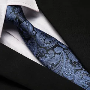 Detailed view of blue paisley pattern men tie for business formal wear and office wedding.