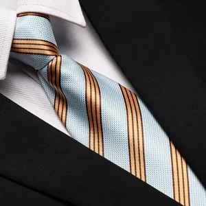 Close-up of a blue and gold striped business necktie with white shirt and black suit.