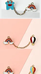 Enamel brooch set detail view, featuring cute rainbow, cloud, and hot air balloon metal pins.