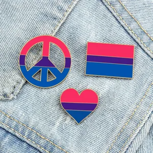 Cute enamel pins set featuring peace sign and heart designs in vibrant pride flag colors for apparel.