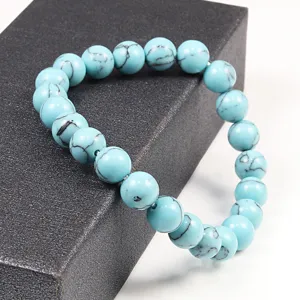 Bracelet élastique en perles de turquoise bleue avec des veines de pierre naturelle noire mode