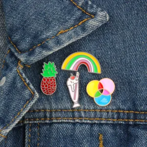 Cute cartoon enamel pins set featuring pineapple, ice cream and rainbow designs for apparel decor.