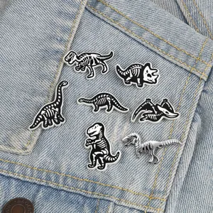 Creative dinosaur skeleton enamel pins set, cool black and white alloy badges for jacket.