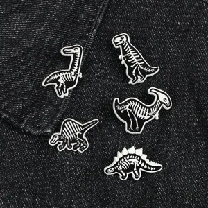 Black and white alloy dinosaur skeleton brooch pin set featuring T-Rex and Stegosaurus.