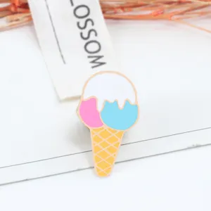 Detailed close-up of a cute ice cream enamel pin with pastel colors, perfect for denim and bags.