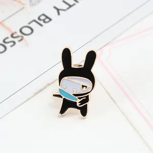 Enamel ninja rabbit brooch detail view, cute cartoon metal badge pin for clothes.