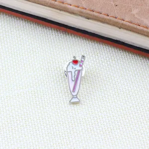 Close-up detail of the cute ice cream milkshake enamel pin, vibrant alloy design.