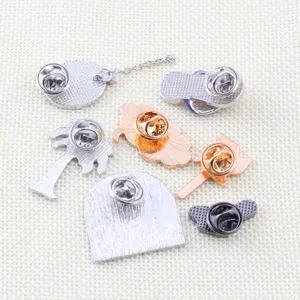 Detailed view of alloy enamel pin backs showing butterfly clutches and various cute shapes.