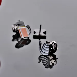 Detailed close-up view of alloy coffee kettle and pot enamel brooch pins badge items.