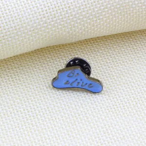Close-up detail shot of a creative blue cloud enamel lapel pin badge with English text design.