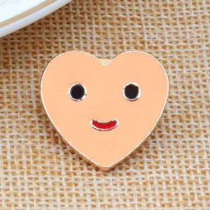 Cute heart shaped enamel pin with smiling face detail, golden edge metal brooch badge for clothes.