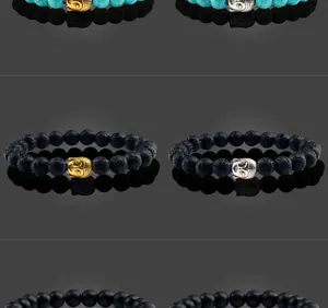 Turquoise en vulkanisch gesteente Boeddha kraal armband gedetailleerd uitzicht elastisch ontwerp.
