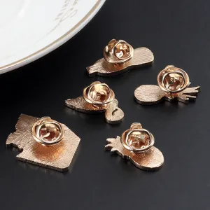 Detailed view of alloy enamel pin backs with secure butterfly clutches, showing fine metal craftsmanship.