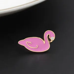 Detailed shot of a sweet pink swan enamel alloy brooch, featuring a cute animal shape badge.