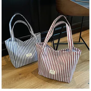 Large capacity striped canvas tote bag, versatile casual shoulder handbag for women.