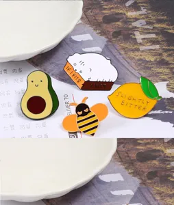 Cute cartoon enamel pins set featuring cat, avocado, bee, and lemon designs for backpacks.