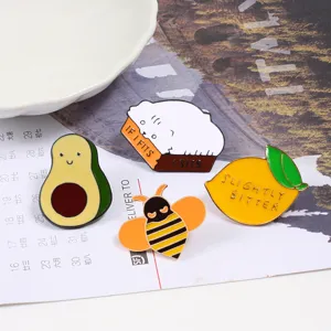 Cute cartoon enamel brooch pin set featuring funny cat, avocado, bee, and lemon designs.