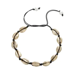 Collana girocollo con conchiglie cauri oro hawaiane corda nera perla boho mare