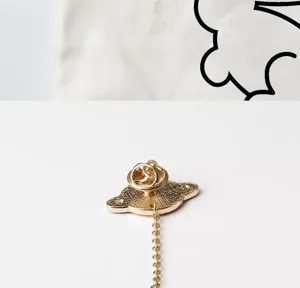 Creative planet astronaut alloy brooch featuring hanging chain, ideal clothing and hat decorative pin.