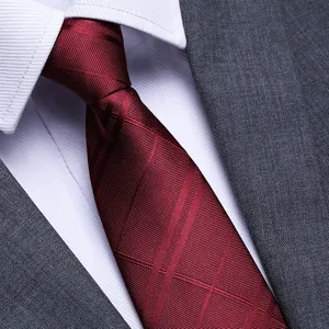 Men's burgundy formal business necktie detail with classic stripes, elegant professional wear style.