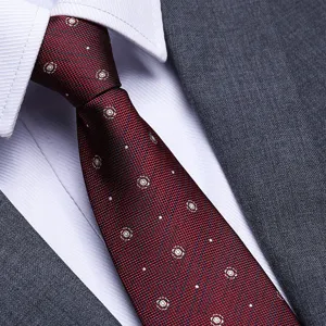 Detailed shot of a classic dark red men's business formal tie with white pattern, elegant style.