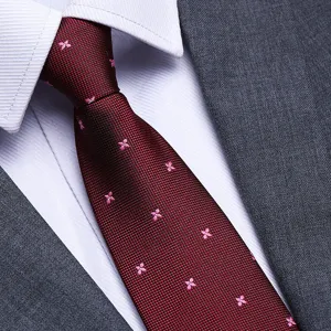 Men's burgundy silk tie with pink floral pattern for business formal wear and weddings.