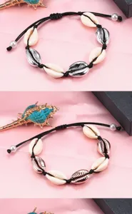Bracciale con conchiglie cauri intrecciato stile boho estate mare vacanza gioiello dettaglio