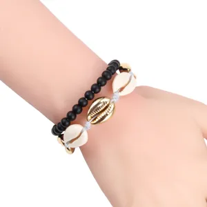 Set di bracciali multistrato bohémien con conchiglie e perle nere, gioielli da spiaggia.