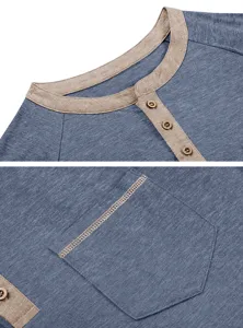 Gros plan sur les détails du col, des boutons et de la poche de la chemise henley pour homme.