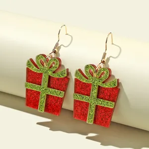 Christmas gift box acrylic earrings detail view, festive red and green glitter holiday jewelry.