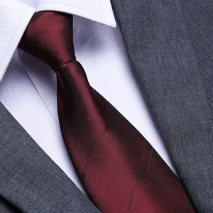 Men's classic burgundy formal business tie detail, premium silk-feel fabric for wedding groom.