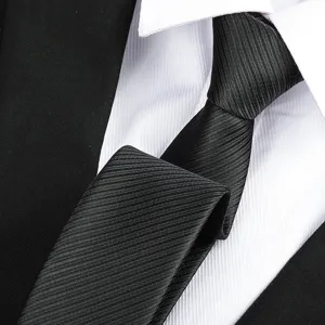 Close-up detail of mens formal black business necktie, classic textured professional tie.