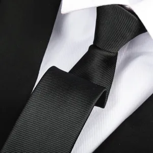 Close-up detail of a classic black twill men's formal necktie showing fine fabric texture.