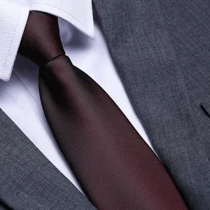 Men's red formal business tie detail shot, classic striped texture for wedding and office wear.