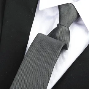 Detailed shot of a classic dark gray textured men business necktie for formal suits and events.