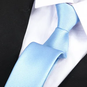 Close-up detail view of a stylish light blue textured business necktie for formal wear.
