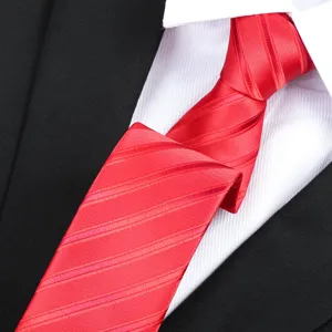 Red striped necktie business formal necktie detail close up classic style suit accessory.