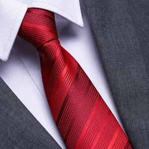 Close-up view of a classic red striped necktie featuring fine woven texture and elegant sheen.