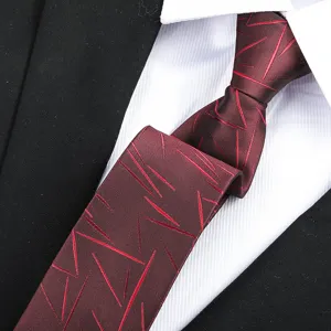 Close-up detail of a mens maroon business necktie with red abstract line pattern for formal wear.