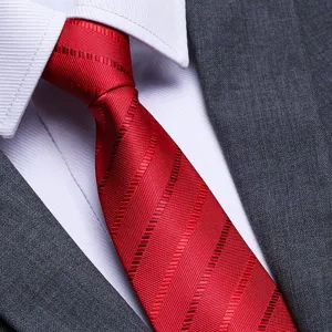 Classic red striped men's tie detailed shot, perfect for formal business and weddings.