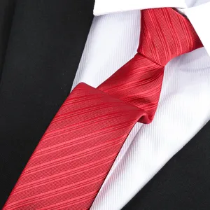 Men's red classic striped necktie close-up, perfect for formal business and wedding suits.