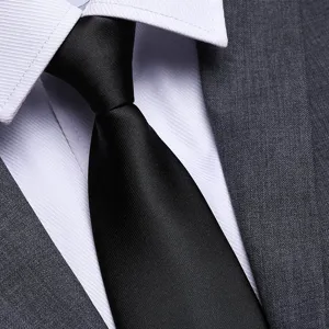 Primo piano del nodo cravatta nera con cerniera, classica trama d'affari dettaglio.