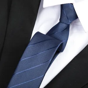 Detailed view of classic men's dark blue striped necktie closeup fabric texture.