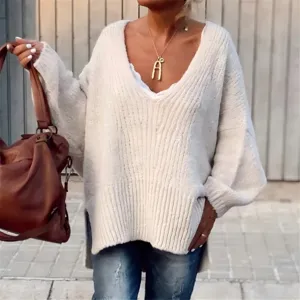 Oversized chunky knit V-neck sweater detailed shot, casual solid color pullover for women.